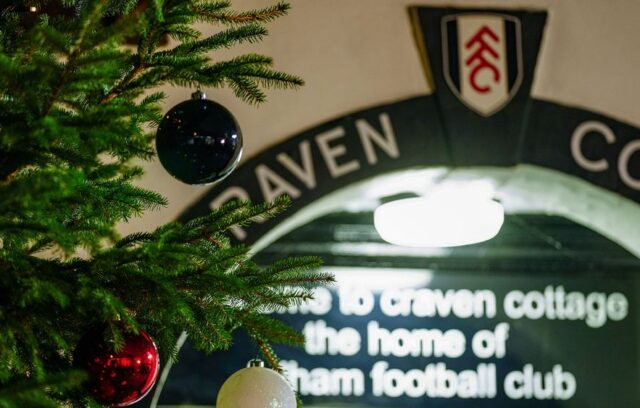 Close up image of the entrance of Craven Cottage with a Christmas tree in shot, too.