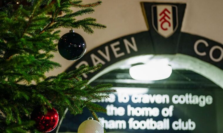 Close up image of the entrance of Craven Cottage with a Christmas tree in shot, too.